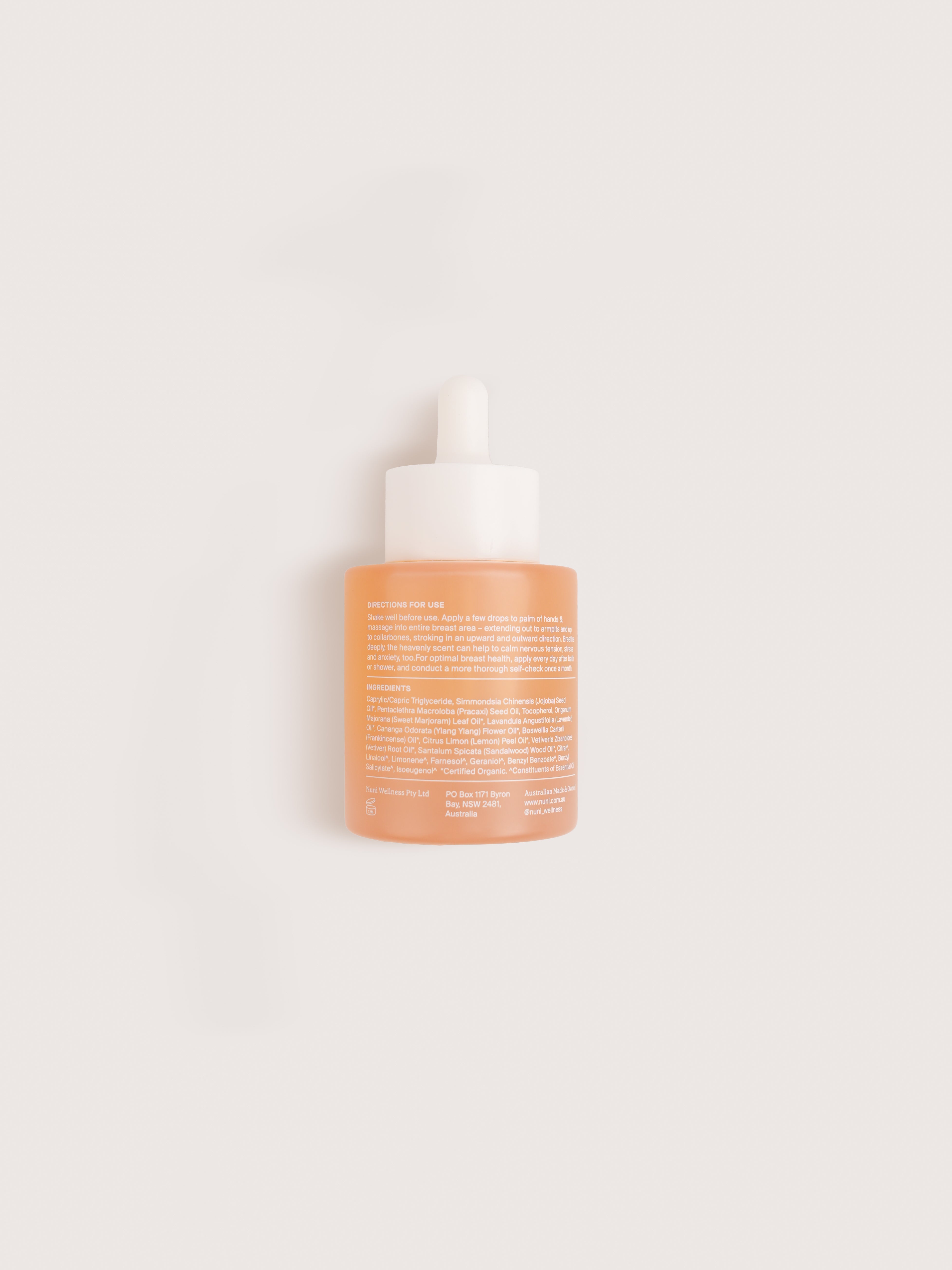 Skincare bottle with text on a light beige background